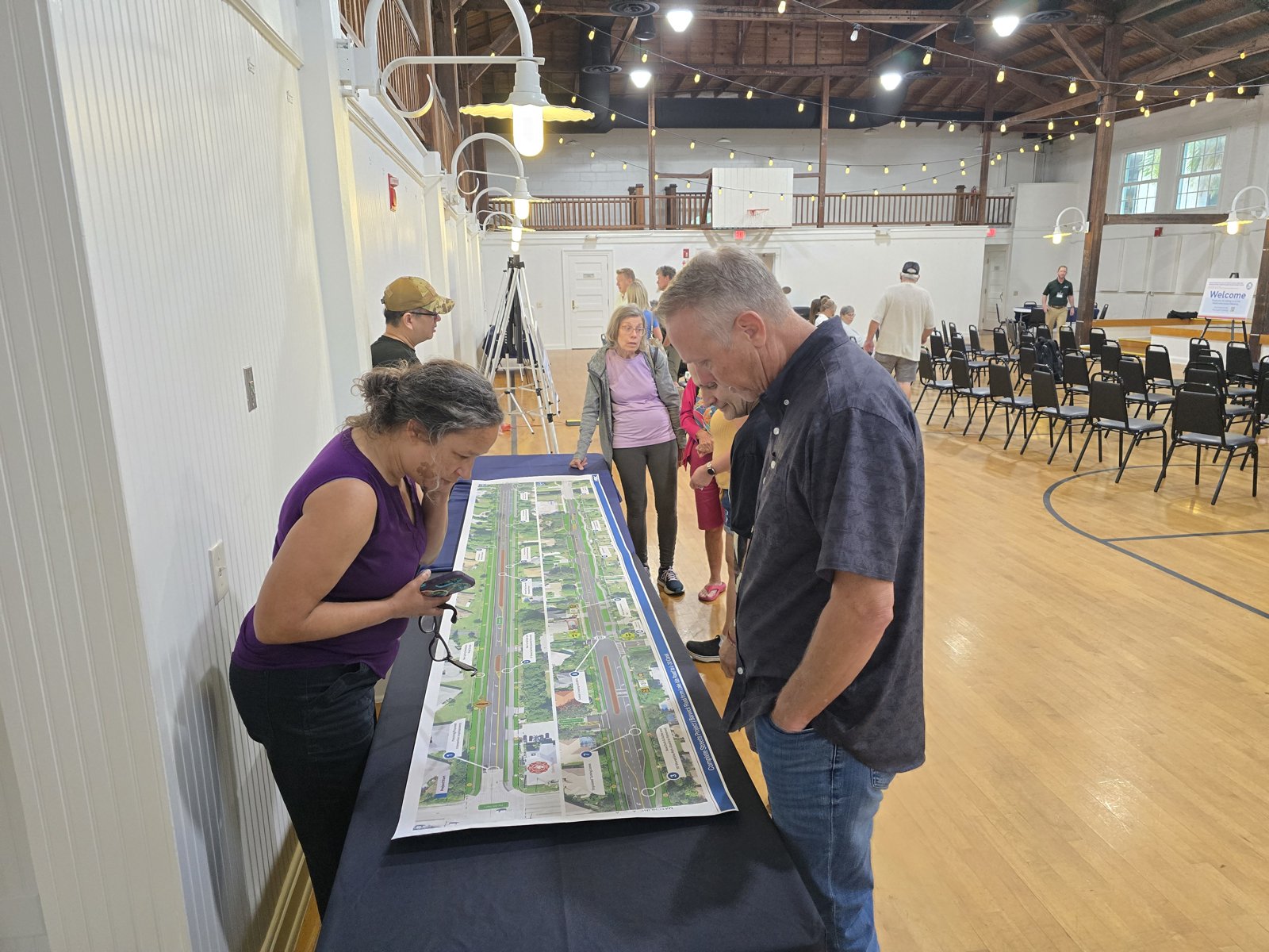 Attendees review the corridor roll plot with the project team.