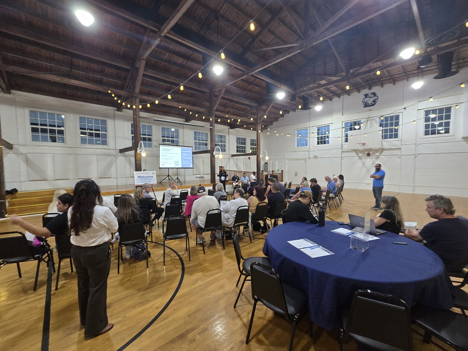 An attendee participates in the public discussion.